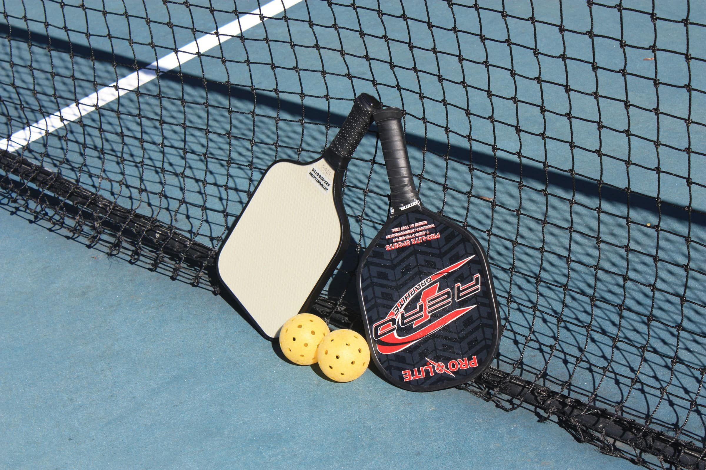 Pickleballs and paddles